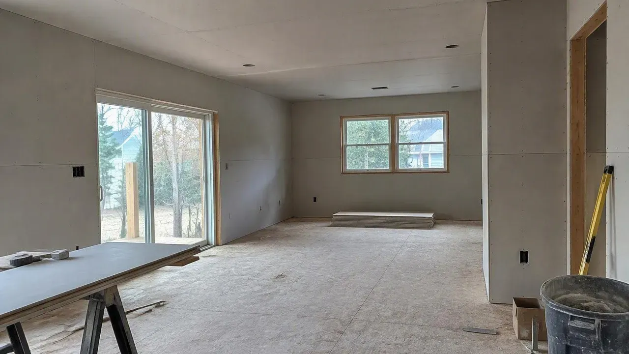 Rebuilt home interior with new drywall panels installed